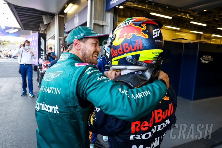 (L to R): Sebastian Vettel (GER) Aston Martin F1 Team celebrates his second position with race winner Sergio Perez (MEX) Red