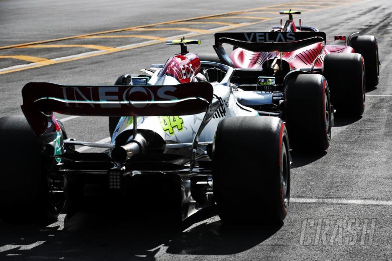 Lewis Hamilton (GBR) Mercedes AMG F1 W13 and Carlos Sainz Jr (ESP) Ferrari F1-75 head to the grid. Formula 1 World
