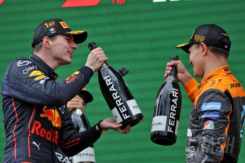 (L to R): Race winner Max Verstappen (NLD) Red Bull Racing celebrates on the podium with third placed Lando Norris (GBR)