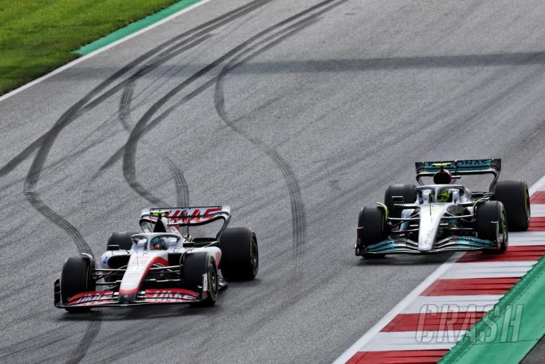 Mick Schumacher (GER) Haas VF-22 and Lewis Hamilton (GBR) Mercedes AMG F1 W13 battle for position. Formula 1 World