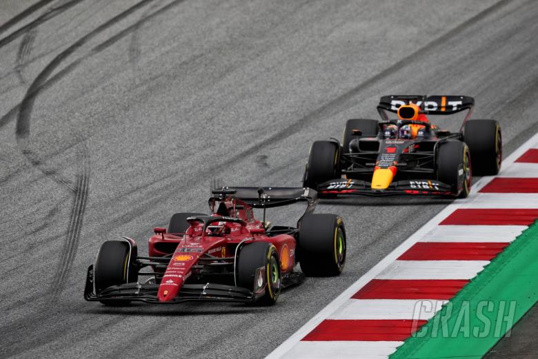 Charles Leclerc (MON) Ferrari F1-75 leads Max Verstappen (NLD) Red Bull Racing RB18. Formula 1 World Championship, Rd 11,