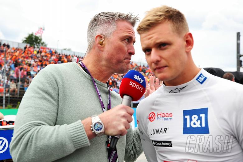 (L to R): Ralf Schumacher (GER) Sky Sport Presenter with Mick Schumacher (GER) Haas F1 Team on the grid. Formula 1 World