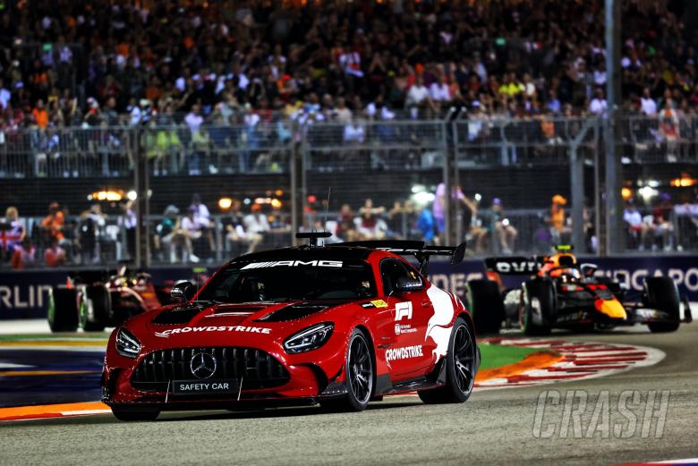 Sergio Perez (MEX) Red Bull Racing RB18 leads behind the Mercedes AMG FIA Safety Car. Formula 1 World Championship, Rd 17,
