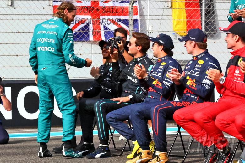 Sebastian Vettel (GER) Aston Martin F1 Team with Lewis Hamilton (GBR) Mercedes AMG F1 at the end of year drivers&#039;