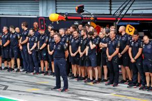 Christian Horner (GBR) Red Bull Racing Team Principal and the Red Bull Racing team in the pits as a minutes's silence is