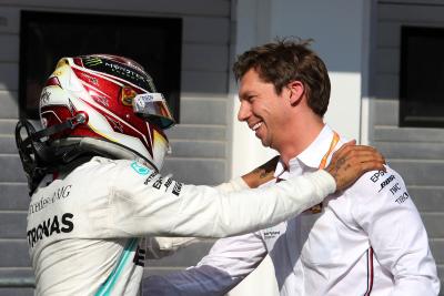 Lewis Hamilton celebrates in parc ferme with James Vowles at Mercedes.