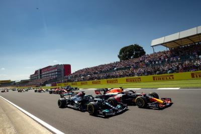 Lewis Hamilton and Max Verstappen go side-by-side at the 2021 British Grand Prix.