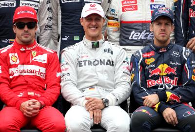 Fernando Alonso alongside Michael Schumacher and Sebastian Vettel.