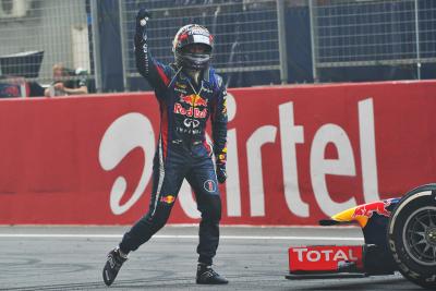 Sebastian Vettel celebrates his fourth title win at the 2013 Indian Grand Prix.