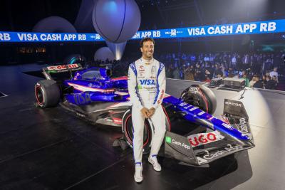 Daniel Ricciardo sitting on the new RB F1 car at their car launch in Las Vegas