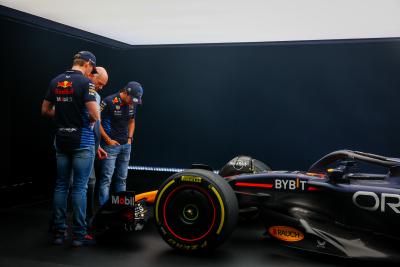Max Verstappen, Adrian Newey and Sergio Perez in front of the new RB20