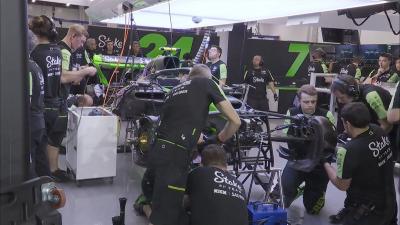 Zhou Guanyu's car being worked on 