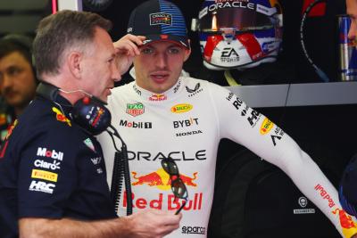 Christian Horner and Max Verstappen pictured in the Red Bull garage