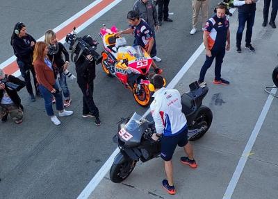 Marc Marquez's Repsol Hondas being warmed up for the test