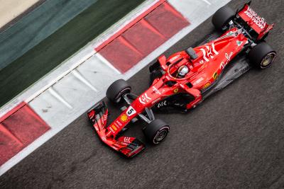 Vettel tops first day of Abu Dhabi test after crash