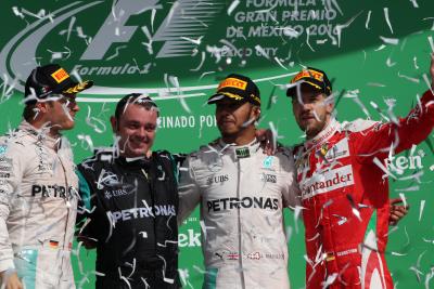 Hamilton defeats Rosberg as Vettel, Verstappen feud