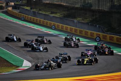 Lewis Hamilton (GBR) Mercedes AMG F1 W11 leads Daniel Ricciardo (AUS) Renault F1 Team RS20 at the restart of the race.