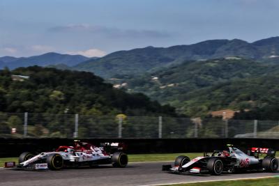 Antonio Giovinazzi (ITA) Alfa Romeo Racing C39 and Kevin Magnussen (DEN) Haas VF-20.