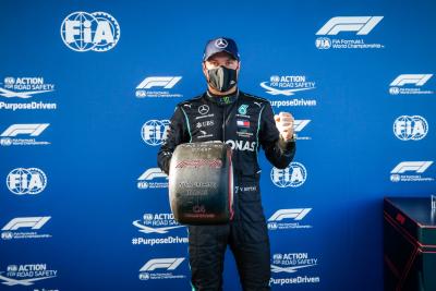 Valtteri Bottas (FIN) Mercedes AMG F1 celebrates with the Pirelli Pole Position award.