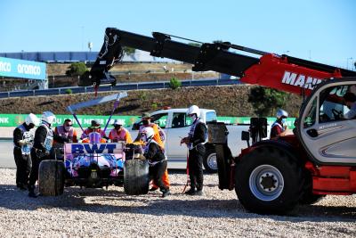 The Racing Point F1 Team RP20 of Lance Stroll (CDN) is removed from the gravel trap by marshals after he crashed in the second practice session.