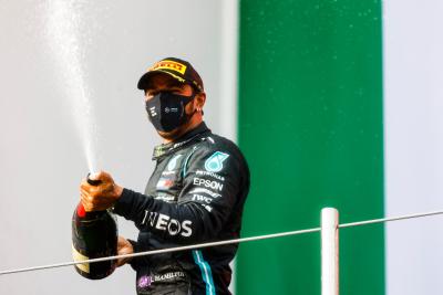 Race winner Lewis Hamilton (GBR) Mercedes AMG F1 celebrates on the podium.