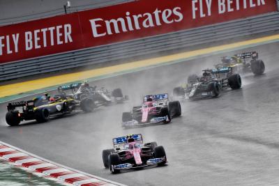 Lance Stroll (CDN) Racing Point F1 Team RP20 leads at the start of the race as Esteban Ocon (FRA) Renault F1 Team RS20 and Valtteri Bottas (FIN) Mercedes AMG F1 W11 spin off the circuit.