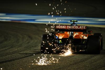 Lando Norris (GBR) McLaren MCL35 sends sparks flying.