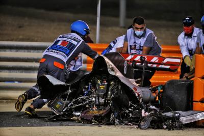 The heavily damaged Haas F1 Team VF-20 of Romain Grosjean (FRA) Haas F1 Team after crashed at the start of the race and exploded into flames, destroying the armco barrier.