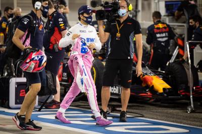 Sergio Perez (MEX) Racing Point F1 Team in the pits while the race is stopped.