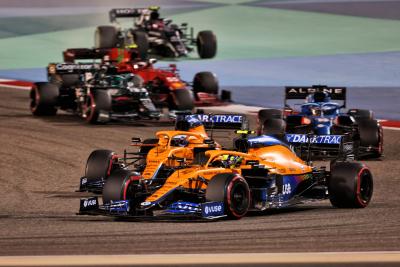 Lando Norris (GBR) McLaren MCL35M and Daniel Ricciardo (AUS) McLaren MCL35M battle for position.