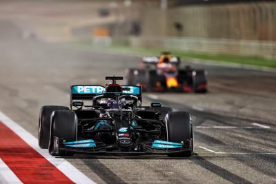 Race winner Lewis Hamilton (GBR) Mercedes AMG F1 W12 takes the chequered flag at the end of the race ahead of second placed Max Verstappen (NLD) Red Bull Racing RB16B.