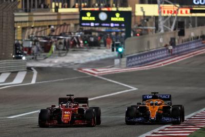 Charles Leclerc (MON) Ferrari SF-21 and Daniel Ricciardo (AUS) McLaren MCL35M battle for position.