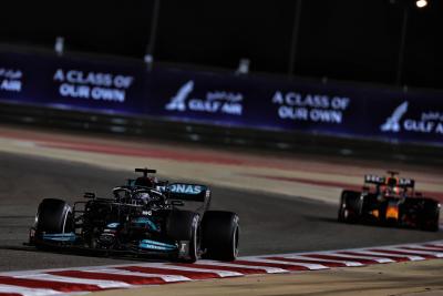 Lewis Hamilton (GBR) Mercedes AMG F1 W12 leads Max Verstappen (NLD) Red Bull Racing RB16B.