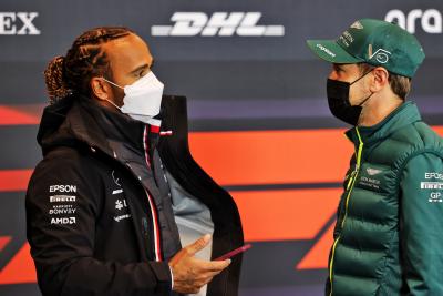 (L to R): Lewis Hamilton (GBR) Mercedes AMG F1 with Sebastian Vettel (GER) Aston Martin F1 Team in the FIA Press Conference.