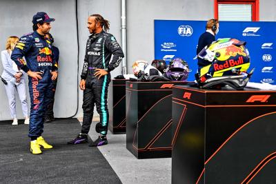 (L to R): second placed Sergio Perez (MEX) Red Bull Racing with pole sitter Lewis Hamilton (GBR) Mercedes AMG F1 in qualifying parc ferme.
