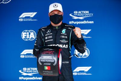 Valtteri Bottas (FIN) Mercedes AMG F1 celebrates with the Pirelli Pole Position Award in qualifying parc ferme.