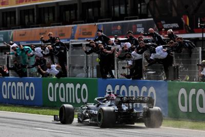 Race winner Lewis Hamilton (GBR) Mercedes AMG F1 W12 passes his celebrating team at the end of the race.