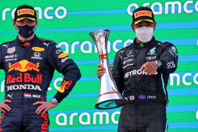 Race winner Lewis Hamilton (GBR) Mercedes AMG F1 celebrates on the podium with Max Verstappen (NLD) Red Bull Racing (Left).