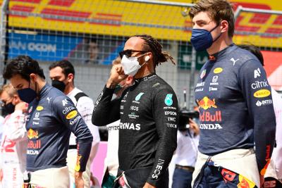 Lewis Hamilton (GBR) Mercedes AMG F1 and Max Verstappen (NLD) Red Bull Racing on the grid.