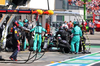 Lewis Hamilton (GBR) Mercedes AMG F1 W12 makes a pit stop.