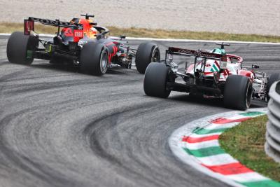 Max Verstappen (NLD) Red Bull Racing RB16B and Robert Kubica (POL) Alfa Romeo Racing C39 Reserve Driver.