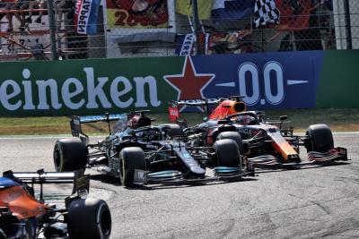 Max Verstappen (NLD) Red Bull Racing RB16B and Lewis Hamilton (GBR) Mercedes AMG F1 W12 crash at the first chicane.