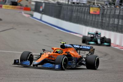 Lando Norris (GBR) McLaren MCL35M leads Lewis Hamilton (GBR) Mercedes AMG F1 W12.