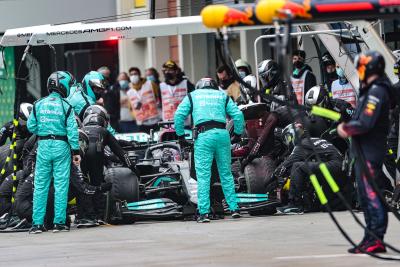 Lewis Hamilton (GBR) Mercedes AMG F1 W12 makes a pit stop.