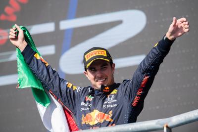 Sergio Perez (MEX) Red Bull Racing celebrates his third position on the podium.