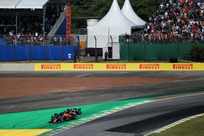 Max Verstappen (NLD) Red Bull Racing RB16B and Lewis Hamilton (GBR) Mercedes AMG F1 W12 battle for the leads of the race.