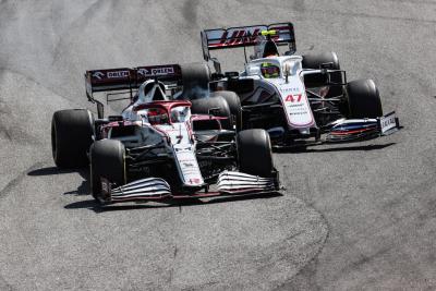 Kimi Raikkonen (FIN) Alfa Romeo Racing C41 and Mick Schumacher (GER) Haas VF-21 make contact.