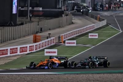 Daniel Ricciardo (AUS) McLaren MCL35M and Sebastian Vettel (GER) Aston Martin F1 Team AMR21 battle for position.