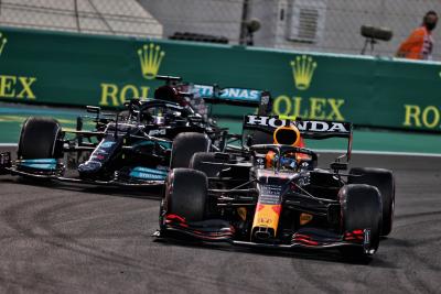 Sergio Perez (MEX) Red Bull Racing RB16B leads Lewis Hamilton (GBR) Mercedes AMG F1 W12.