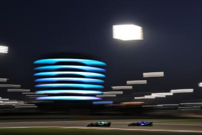 Sebastian Vettel (GER) Aston Martin F1 Team AMR22 and Nicholas Latifi (CDN) Williams Racing FW44.